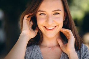 Happy woman smiling and showing her teeth