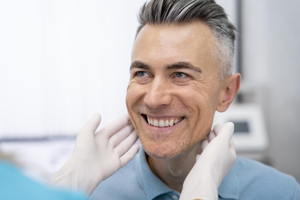 Dentist checking a dental patient’s smile